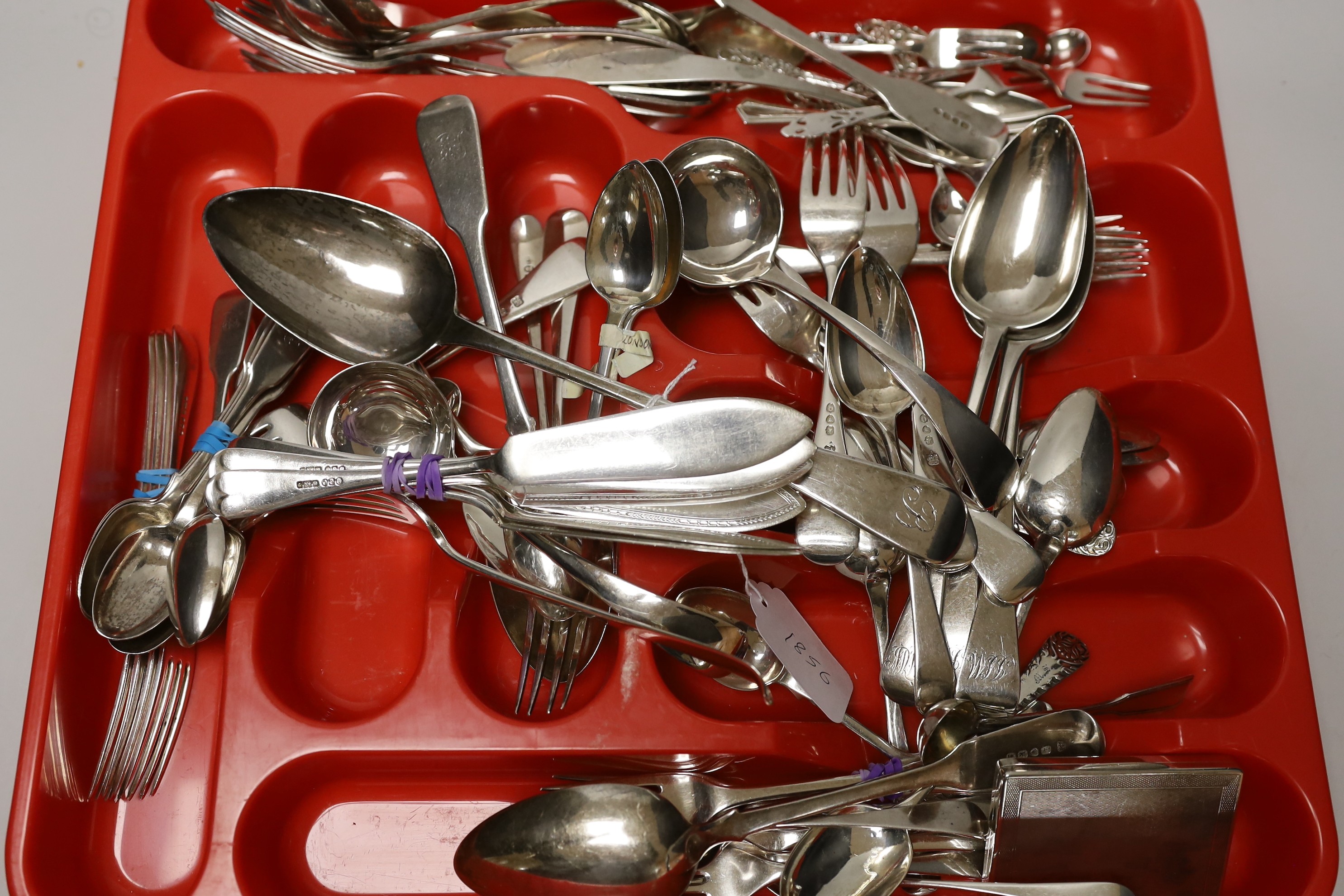 A large quantity of mixed silver cutlery, various dates, makers and patterns, including a George III silver basting spoon, a silver cigarette case and a small group of plated flatware.